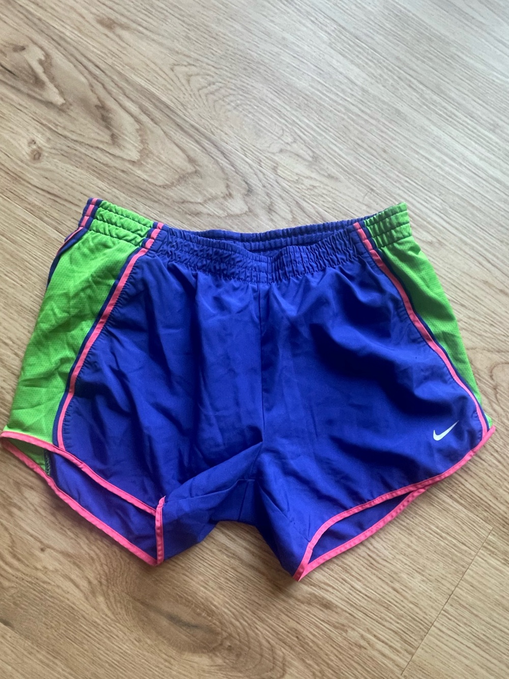 Nike Women's Royal Blue Athletic Shorts with Green Panels and Pink Trim